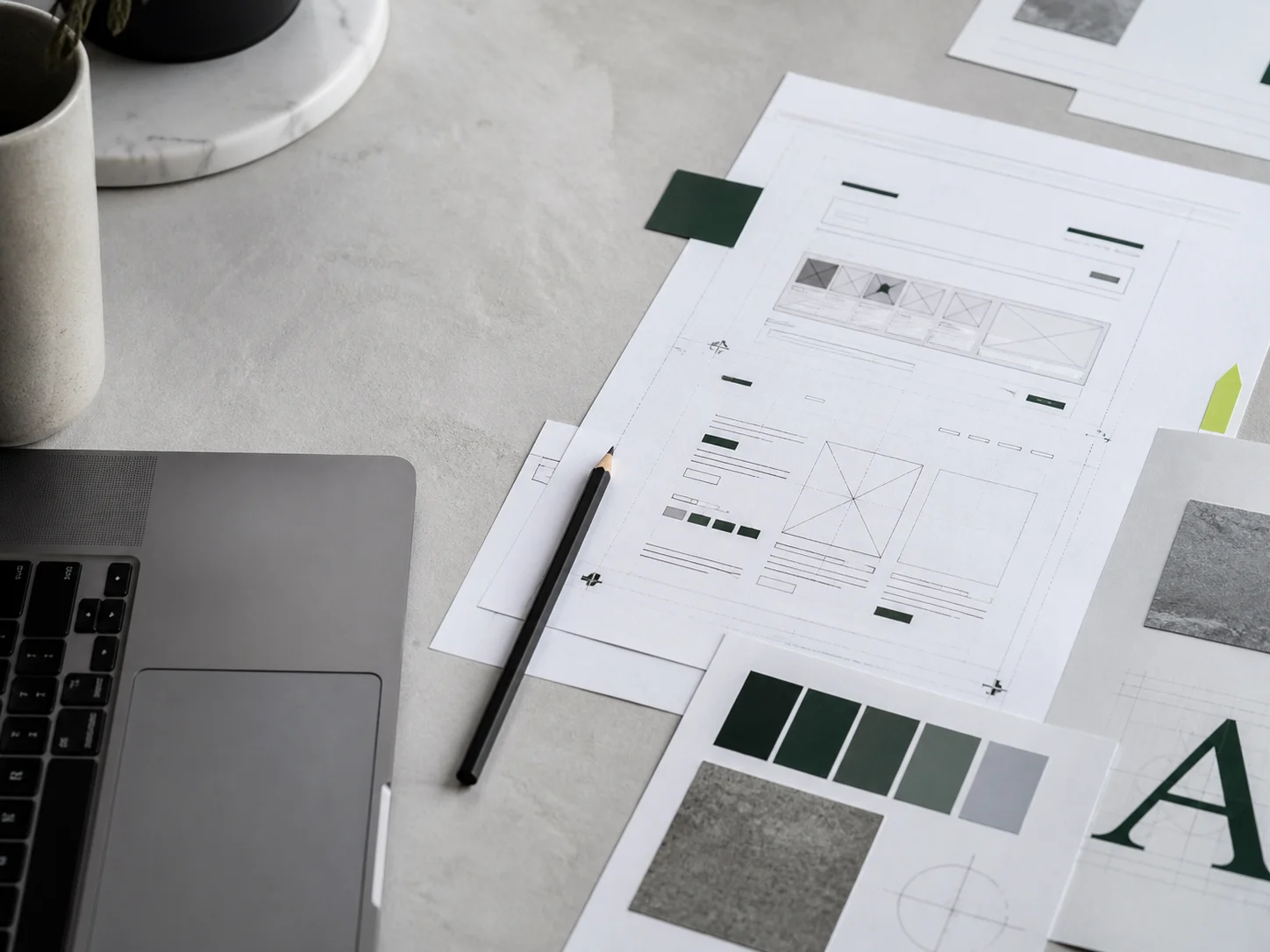 Shaxx Digital website design process with wireframes and brand materials